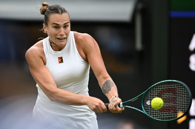 (250707) -- LONDON, July 7, 2025 (Xinhua) -- Aryna Sabalenka hits a return during the women's singles fourth round match between Aryna Sabalenka of Belarus and Elise Mertens of Belgium at the Wimbledon Tennis Championships in London, Britain, July 6, 2025. (Xinhua/Zhao Dingzhe)