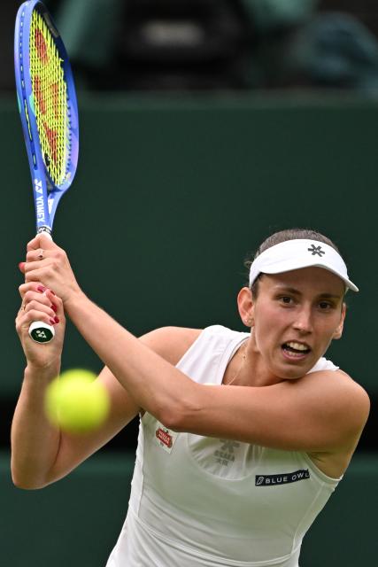 (250707) -- LONDON, July 7, 2025 (Xinhua) -- Elise Mertens hits a return during the women's singles fourth round match between Aryna Sabalenka of Belarus and Elise Mertens of Belgium at the Wimbledon Tennis Championships in London, Britain, July 6, 2025. (Xinhua/Zhao Dingzhe)