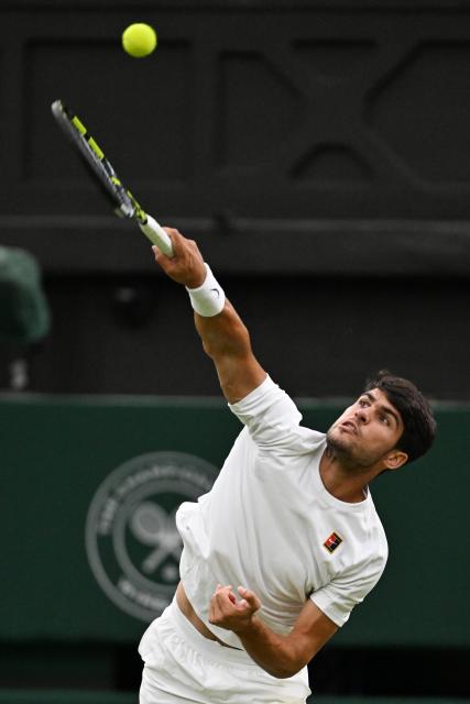 (250707) -- LONDON, July 7, 2025 (Xinhua) -- Carlos Alcaraz hits a return during the men's singles fourth round match between Carlos Alcaraz of Spain and Andrey Rublev of Russia at the Wimbledon Tennis Championships in London, Britain, July 6, 2025. (Xinhua/Zhao Dingzhe)