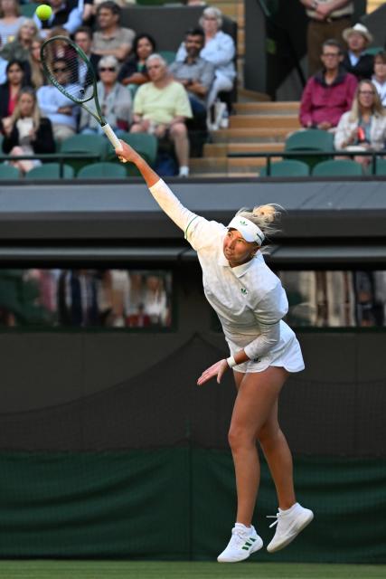 (250708) -- LONDON, July 8, 2025 (Xinhua) -- Clara Tauson serves during the women's singles round of 8 match between Iga Swiatek of Poland and Clara Tauson of Denmark at the Wimbledon Tennis Championships in London, Britain, July 7, 2025. (Xinhua/Zhao Dingzhe)