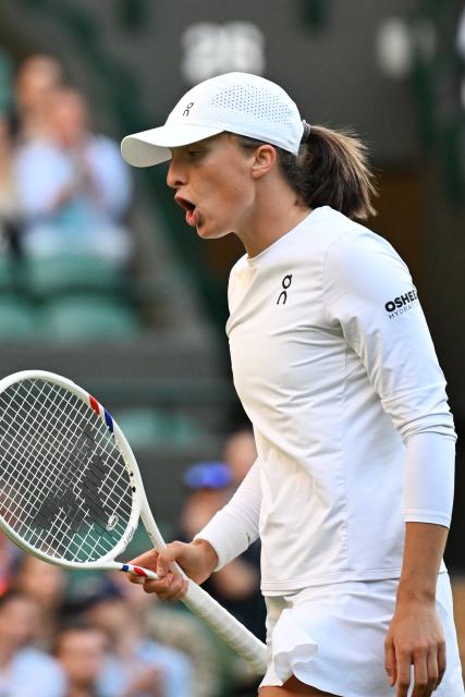 (250708) -- LONDON, July 8, 2025 (Xinhua) -- Iga Swiatek reacts during the women's singles round of 8 match between Iga Swiatek of Poland and Clara Tauson of Denmark at the Wimbledon Tennis Championships in London, Britain, July 7, 2025. (Xinhua/Zhao Dingzhe)