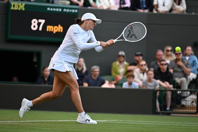 (250708) -- LONDON, July 8, 2025 (Xinhua) -- Iga Swiatek hits a return during the women's singles round of 8 match between Iga Swiatek of Poland and Clara Tauson of Denmark at the Wimbledon Tennis Championships in London, Britain, July 7, 2025. (Xinhua/Zhao Dingzhe)