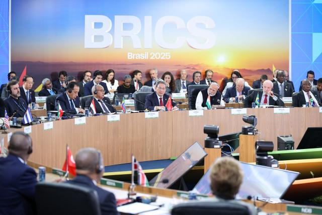 (250707) -- RIO DE JANEIRO, July 7, 2025 (Xinhua) -- Chinese Premier Li Qiang addresses a plenary session of the 17th BRICS Summit in Rio de Janeiro, Brazil, July 6, 2025. Li spoke on topics including strengthening multilateralism, artificial intelligence, environment and climate change, and global health at the plenary sessions of the summit in Rio de Janeiro on Sunday and Monday. (Xinhua/Liu Bin)