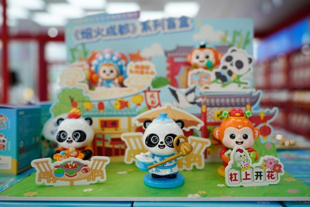 (250708) -- CHENGDU, July 8, 2025 (Xinhua) -- This photo taken on July 8, 2025 shows products on display at an official licensed products store for the World Games 2025 in Chengdu, southwest China's Sichuan Province. The Games hit the 30-day countdown mark today and will be held from August 7 to 17. (Xinhua/Xu Bingjie)