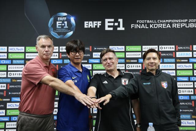 (250708) -- YONGIN, July 8, 2025 (Xinhua) -- Head coach of Team China Ante Milicic, head coach of Team South Korea Shin Sang-Woo, head coach of Team Japan Nils Nielsen and head coach of Team Chinese Taipei Chan Hiu-Ming (from L to R) pose during a press conference one day before the women's football match between China and South Korea at the EAFF (East Asian Football Federation) E-1 Football Championship 2025 Final in Yongin, South Korea, July 8, 2025. (Xinhua/Huang Xinxin)