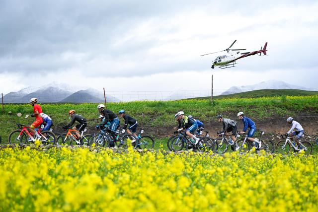 (250708) -- MENYUAN, July 8, 2025 (Xinhua) -- Cyclists compete during the Stage 3 of the Tour of Magnificent Qinghai International Road Cycling Race from Huzhu to Menyuan, northwest China's Qinghai Province, July 8, 2025. (Xinhua/Zhang Long)