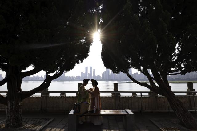 (250708) -- NANCHANG, July 8, 2025 (Xinhua) -- Tourists visit the Tengwang Pavilion scenic area in Nanchang City, east China's Jiangxi Province, on July 7, 2025. The Tengwang Pavilion, the 29th iteration in its 1,400-year history, features intricately carved beams and vibrantly painted rafters. It stands majestically along the banks of the Ganjiang River, which winds through eastern China's Jiangxi Province. About 90 percent of the scenic area has been open to the public for free as of Jan. 1 this year when a northward expansion project was fully completed. (Xinhua/Liu Jinhai)
