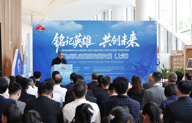 (250708) -- SHANGHAI, July 8, 2025 (Xinhua) -- Jeffrey Greene, chairman of the Sino-American Aviation Heritage Foundation, addresses the opening ceremony of the Flying Tigers Photo Exhibition in Shanghai, east China, July 8, 2025. Themed "Remembering heroes and creating the future together," the exhibition opened here on Tuesday, showcasing hundreds of valuable photos as well as other items of historic significance contributed by veterans of the Flying Tigers. (Xinhua/Fang Zhe)