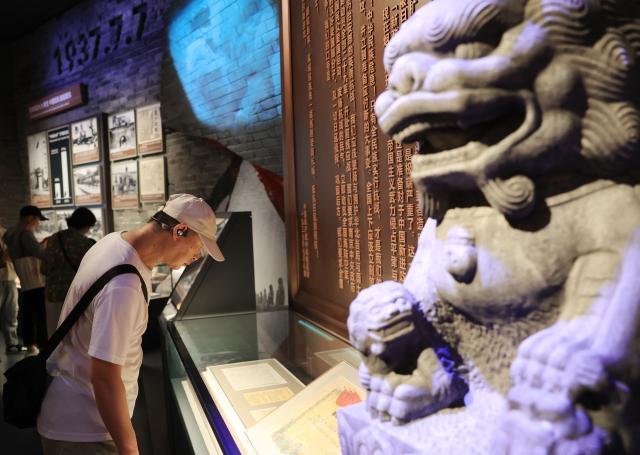 (250708) -- BEIJING, July 8, 2025 (Xinhua) -- People visit an exhibition themed "For National Liberation and World Peace" at the Museum of the War of Chinese People's Resistance Against Japanese Aggression in Beijing, capital of China, July 8, 2025. The exhibition commemorating the 80th anniversary of the victory in the Chinese People's War of Resistance Against Japanese Aggression and the World Anti-Fascist War opened to public here on Tuesday.
   The exhibition features 1,525 photos and 3,237 artifacts across an area of 12,200 square meters. (Xinhua/Zhang Chenlin)