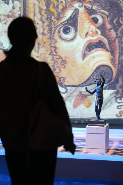 (250708) -- CHANGSHA, July 8, 2025 (Xinhua) -- A visitor visits the exhibition "Meet Pompeii: The Eternal City" at the Hunan Museum in Changsha, capital of central China's Hunan Province, July 8, 2025. This exhibition showcasing cultural relics from ancient Pompeii opened here on Tuesday.
   It features more than 130 artifacts, including frescoes, sculptures, and bronze and gold ware, and will run through November 2 this year.
   Pompeii, situated between Naples and the Amalfi Coast, is a UNESCO World Heritage Site. The ancient city was buried under volcanic ash and pumice during the catastrophic eruption of Mount Vesuvius in the year 79. (Xinhua/Xue Yuge)