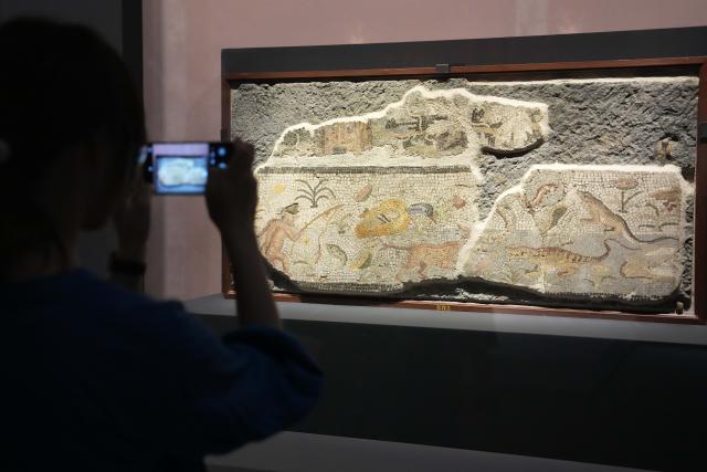 (250708) -- CHANGSHA, July 8, 2025 (Xinhua) -- A visitor takes photos at the exhibition "Meet Pompeii: The Eternal City" at the Hunan Museum in Changsha, capital of central China's Hunan Province, July 8, 2025. This exhibition showcasing cultural relics from ancient Pompeii opened here on Tuesday.
   It features more than 130 artifacts, including frescoes, sculptures, and bronze and gold ware, and will run through November 2 this year.
   Pompeii, situated between Naples and the Amalfi Coast, is a UNESCO World Heritage Site. The ancient city was buried under volcanic ash and pumice during the catastrophic eruption of Mount Vesuvius in the year 79. (Xinhua/Xue Yuge)