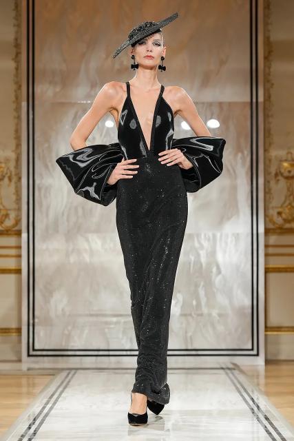 (250709) -- PARIS, July 9, 2025 (Xinhua) -- A model presents a creation from the haute couture Fall-Winter 2025/2026 collections by Giorgio Armani Prive during the Paris Haute Couture Week, in Paris, France, on July 8, 2025. (MeetEurope/Handout via Xinhua)