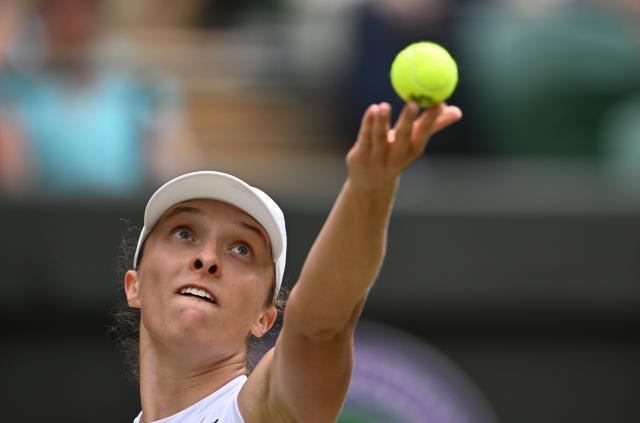 (250709) -- LONDON, July 9, 2025 (Xinhua) -- Iga Swiatek serves during the women's singles quarterfinal match between Iga Swiatek of Poland and Liudmila Samsonova of Russia at the Wimbledon Tennis Championships in London, Britain, July 9, 2025. (Xinhua/Zhao Dingzhe)