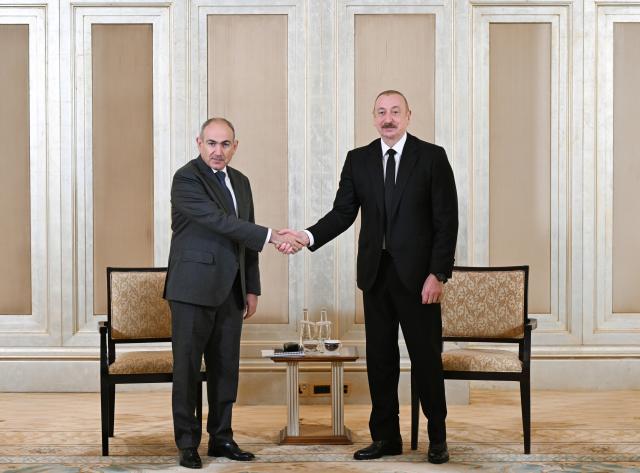 (250710) -- ABU DHABI, July 10, 2025 (Xinhua) -- Azerbaijani President Ilham Aliyev (R) and Armenian Prime Minister Nikol Pashinyan hold talks in Abu Dhabi, the United Arab Emirates, July 10, 2025. Aliyev and Pashinyan agreed to advance efforts toward normalizing relations between their countries, the Foreign Ministry of Azerbaijan said on Thursday. (Azerbaijan State News Agency/Handout via Xinhua)
