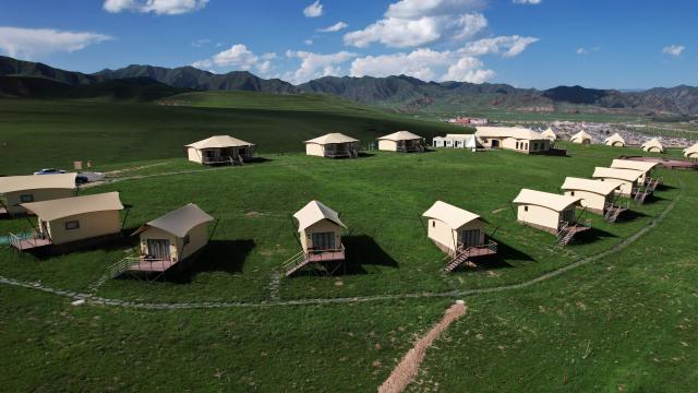 (250711) -- XIAHE, July 11, 2025 (Xinhua) -- An aerial drone photo taken on July 10, 2025 shows a camp at the Sangke Grassland in Xiahe County, Gannan Tibetan Autonomous Prefecture, northwest China's Gansu Province. (Xinhua/Yu Lan)