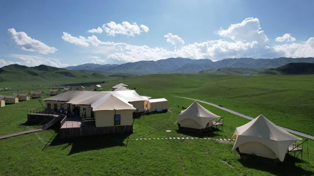 (250711) -- XIAHE, July 11, 2025 (Xinhua) -- An aerial drone photo taken on July 10, 2025 shows a camp at the Sangke Grassland in Xiahe County, Gannan Tibetan Autonomous Prefecture, northwest China's Gansu Province. (Xinhua/Ma Ning)