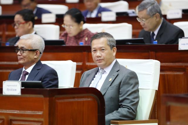 (250711) -- PHNOM PENH, July 11, 2025 (Xinhua) -- Cambodian Prime Minister Hun Manet (1st R, front) attends a National Assembly session in Phnom Penh, Cambodia, on July 11, 2025. The National Assembly of Cambodia on Friday amended the country's constitution, allowing the government to create a legal framework to revoke Cambodian citizenship from any individuals who conspire with foreign countries to destroy national interests. (Photo by Sovannara/Xinhua)