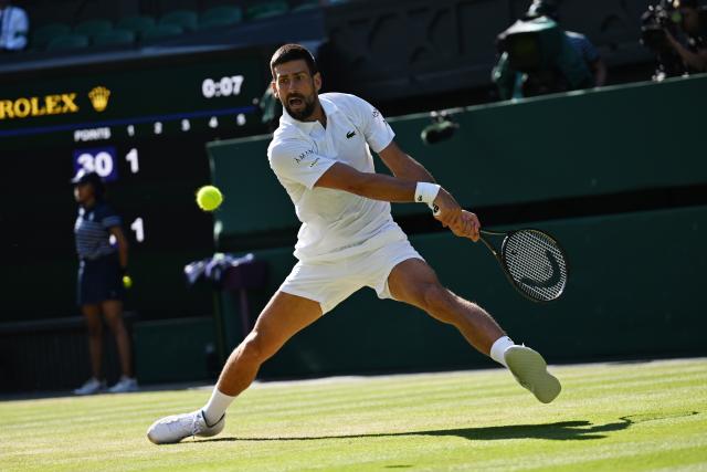 (250712) -- LONDON, July 12, 2025 (Xinhua) -- Novak Djokovic hits a return during the men's singles semifinal match between Jannik Sinner of Italy and Novak Djokovic of Serbia at the Wimbledon Tennis Championships in London, Britain, July 11, 2025. (Xinhua/Zhao Dingzhe)