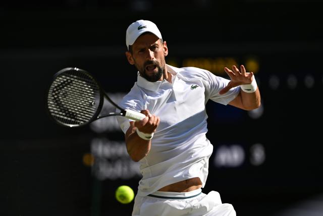 (250712) -- LONDON, July 12, 2025 (Xinhua) -- Novak Djokovic hits a return during the men's singles semifinal match between Jannik Sinner of Italy and Novak Djokovic of Serbia at the Wimbledon Tennis Championships in London, Britain, July 11, 2025. (Xinhua/Zhao Dingzhe)