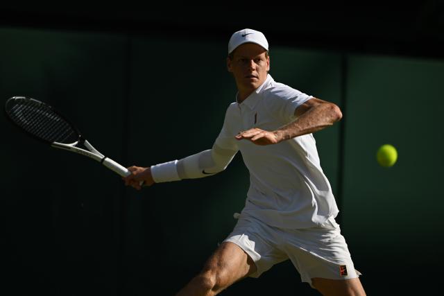 (250712) -- LONDON, July 12, 2025 (Xinhua) -- Jannik Sinner hits a return during the men's singles semifinal match between Jannik Sinner of Italy and Novak Djokovic of Serbia at the Wimbledon Tennis Championships in London, Britain, July 11, 2025. (Xinhua/Zhao Dingzhe)