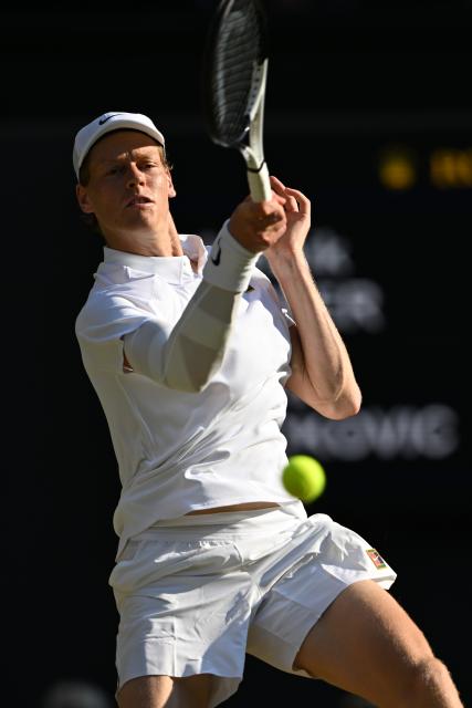 (250712) -- LONDON, July 12, 2025 (Xinhua) -- Jannik Sinner hits a return during the men's singles semifinal match between Jannik Sinner of Italy and Novak Djokovic of Serbia at the Wimbledon Tennis Championships in London, Britain, July 11, 2025. (Xinhua/Zhao Dingzhe)