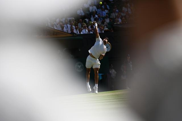 (250712) -- LONDON, July 12, 2025 (Xinhua) -- Carlos Alcaraz serves during the men's singles semifinal match between Carlos Alcaraz of Spain and Taylor Fritz of the United States at the Wimbledon Tennis Championships in London, Britain, July 11, 2025. (Xinhua/Zhao Dingzhe)