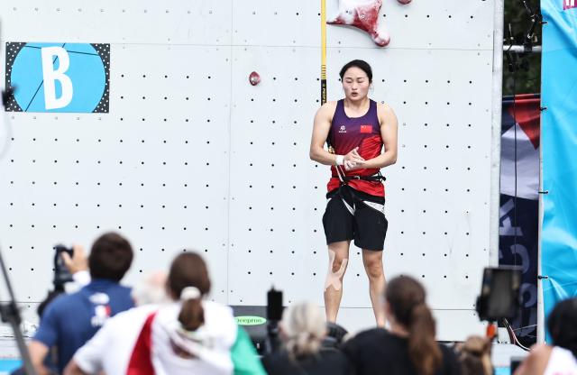 (250712) -- CHARMONIX, July 12, 2025 (Xinhua) -- Zhang Shaoqin of China reacts before the Women's Speed Qualification of sport climbing at the 2025 IFSC Climbing World Cup Speed-Lead in Charmonix, France, July 11, 2025. (Xinhua/Gao Jing)