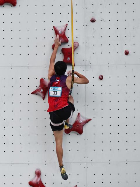 (250712) -- CHARMONIX, July 12, 2025 (Xinhua) -- Long Jianguo of China competes during the men's Speed Qualification of sport climbing at the 2025 IFSC Climbing World Cup Speed-Lead in Charmonix, France, July 11, 2025. (Xinhua/Gao Jing)