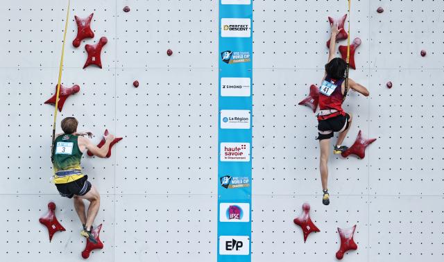 (250712) -- CHARMONIX, July 12, 2025 (Xinhua) -- Chu Shouhong (R) of China competes during the men's Speed Qualification of sport climbing at the 2025 IFSC Climbing World Cup Speed-Lead in Charmonix, France, July 11, 2025. (Xinhua/Gao Jing)