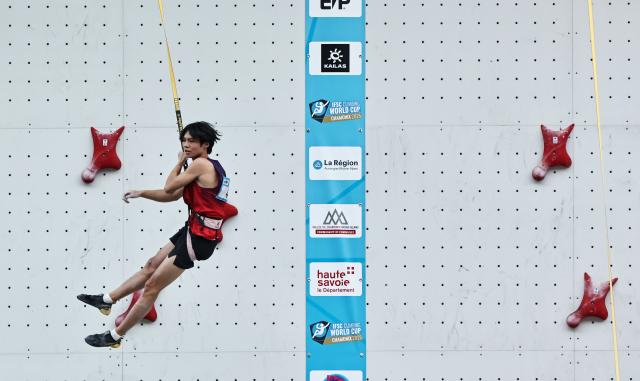 (250712) -- CHARMONIX, July 12, 2025 (Xinhua) -- Chu Shouhong of China reacts during the men's Speed Qualification of sport climbing at the 2025 IFSC Climbing World Cup Speed-Lead in Charmonix, France, July 11, 2025. (Xinhua/Gao Jing)