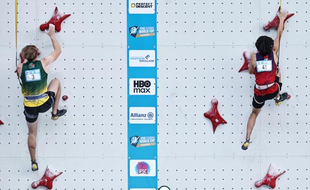 (250712) -- CHARMONIX, July 12, 2025 (Xinhua) -- Chu Shouhong (R) of China competes during the men's Speed Qualification of sport climbing at the 2025 IFSC Climbing World Cup Speed-Lead in Charmonix, France, July 11, 2025. (Xinhua/Gao Jing)