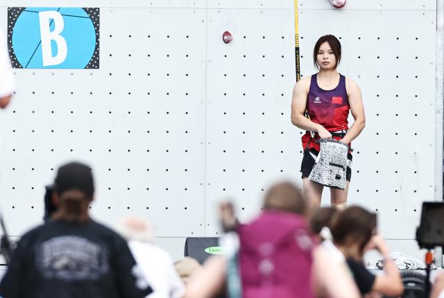 (250712) -- CHAMONIX, July 12, 2025 (Xinhua) -- Qin Yumei of China reacts during the women's Speed Qualification of sport climbing at the 2025 IFSC Climbing World Cup Speed-Lead in Charmonix, France, July 11, 2025. (Xinhua/Gao Jing)