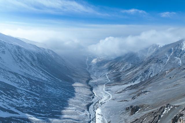 (250712) -- XINING, July 12, 2025 (Xinhua) -- An aerial drone photo taken on Jan. 23, 2024 shows Mount Gangshika in Menyuan Hui Autonomous County, northwest China's Qinghai Province. (Xinhua/Zhang Long)