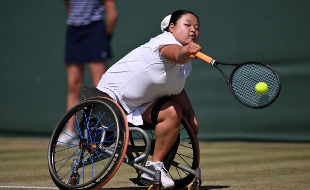 (250712) -- LONDON, July 12, 2025 (Xinhua) -- Wang Ziying hits a return during the women's wheelchair singles final between Wang Ziying of China and Kamiji Yui of Japan at the Wimbledon Tennis Championships in London, Britain, July 12, 2025. (Xinhua/Li Ying)