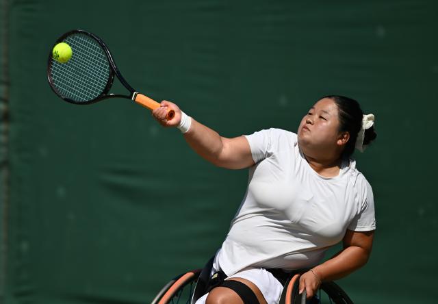 (250712) -- LONDON, July 12, 2025 (Xinhua) -- Wang Ziying hits a return during the women's wheelchair singles final between Wang Ziying of China and Kamiji Yui of Japan at the Wimbledon Tennis Championships in London, Britain, July 12, 2025. (Xinhua/Li Ying)