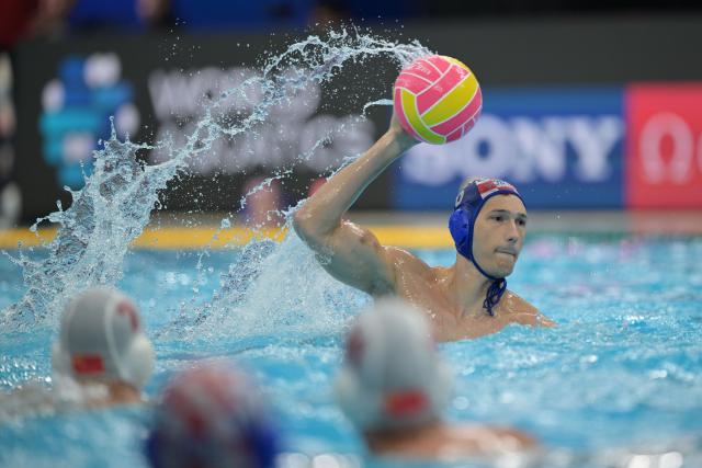 (250712) -- SINGAPORE, July 12, 2025 (Xinhua) -- Luka Bukic (R) of Croatia competes during the men's water polo preliminary match between China and Croatia at World Aquatics Championship 2025 in Singapore on July 12, 2025. (Xinhua/Then Chih Wey)