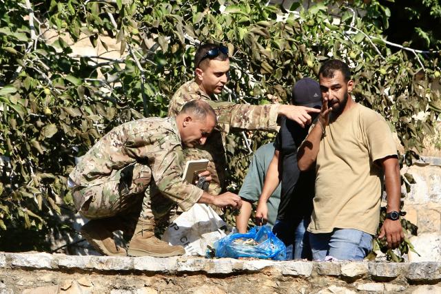 (250712) -- AL-NUMAIRIYAH, July 12, 2025 (Xinhua) -- Lebanese army soldiers and civilians collect the remnants of Israeli drone missiles in the town of Al-Numairiyah, Lebanon, on July 11, 2025.
  The Israel Defense Forces (IDF) said in a statement on Friday that the man it killed earlier in the day in an airstrike in Lebanon was involved in advancing attacks against Israeli civilians.
   Official and security sources in Lebanon reported earlier that Mohammad Hassan Shuaib was killed and five others were injured in an Israeli drone strike targeting a car in the town of Al-Numairiyah in southern Lebanon. (Photo by Ali Hashisho/Xinhua)