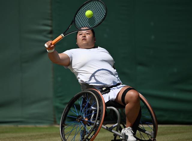 (250712) -- LONDON, July 12, 2025 (Xinhua) -- Wang Ziying hits a return during the women's wheelchair singles final between Wang Ziying of China and Kamiji Yui of Japan at the Wimbledon Tennis Championships in London, Britain, July 12, 2025. (Xinhua/Li Ying)