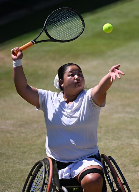 (250712) -- LONDON, July 12, 2025 (Xinhua) -- Wang Ziying serves during the women's wheelchair singles final between Wang Ziying of China and Kamiji Yui of Japan at the Wimbledon Tennis Championships in London, Britain, July 12, 2025. (Xinhua/Li Ying)