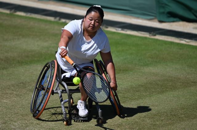 (250712) -- LONDON, July 12, 2025 (Xinhua) -- Wang Ziying hits a return during the women's wheelchair singles final between Wang Ziying of China and Kamiji Yui of Japan at the Wimbledon Tennis Championships in London, Britain, July 12, 2025. (Xinhua/Li Ying)