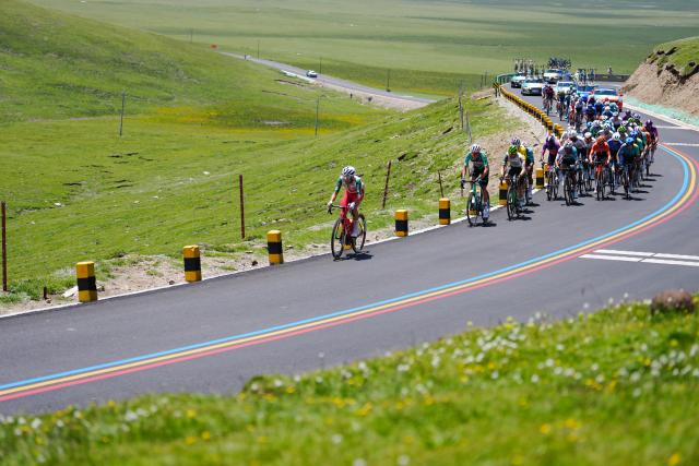(250712) -- HAIYAN, July 12, 2025 (Xinhua) -- Cyclists compete during the Stage 7 of the Tour of Magnificent Qinghai International Road Cycling Race from Gonghe to Haiyan, northwest China's Qinghai Province, July 12, 2025. (Xinhua/Qi Zhiyue)