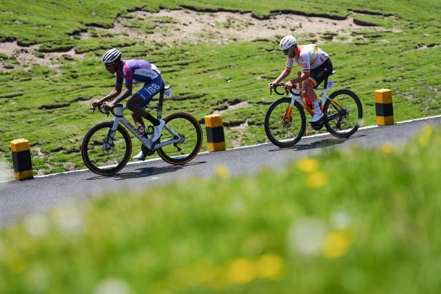 (250712) -- HAIYAN, July 12, 2025 (Xinhua) -- Even Yemane (L) of Istanbul Buyuksehir Belediye Spor Türkiye and Grosu Eduard Michael of Huangsheng-Vonoa-Taishan Sport Team compete during the Stage 7 of the Tour of Magnificent Qinghai International Road Cycling Race from Gonghe to Haiyan, northwest China's Qinghai Province, July 12, 2025. (Xinhua/Qi Zhiyue)