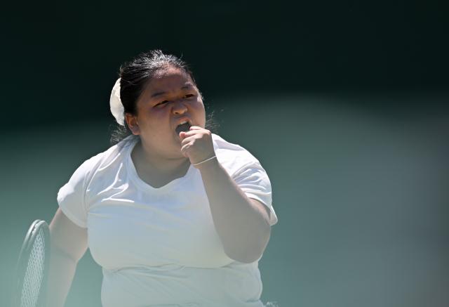 (250712) -- LONDON, July 12, 2025 (Xinhua) -- Wang Ziying celebrates victory after the women's wheelchair singles final between Wang Ziying of China and Kamiji Yui of Japan at the Wimbledon Tennis Championships in London, Britain, July 12, 2025. (Xinhua/Li Ying)