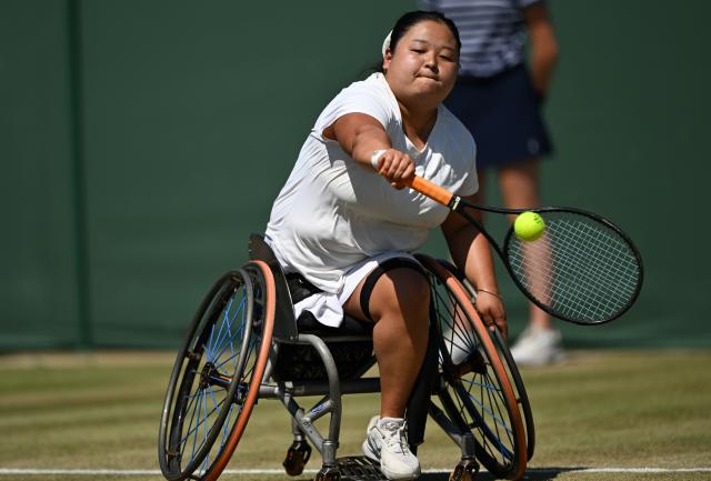 (250712) -- LONDON, July 12, 2025 (Xinhua) -- Wang Ziying hits a return during the women's wheelchair singles final between Wang Ziying of China and Kamiji Yui of Japan at the Wimbledon Tennis Championships in London, Britain, July 12, 2025. (Xinhua/Li Ying)