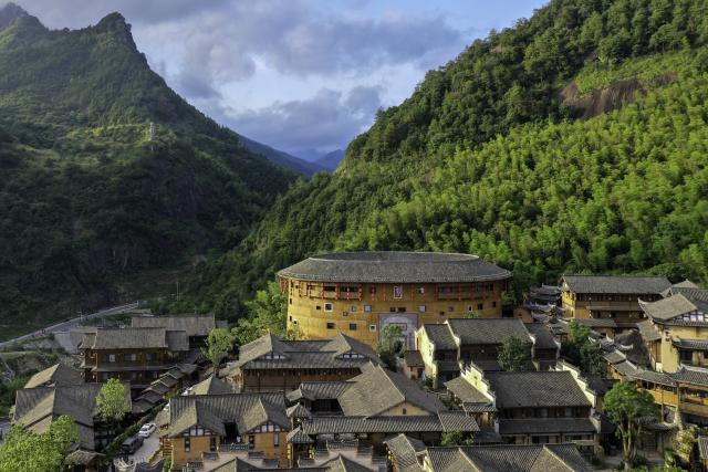 (250712) -- SHANGRAO, July 12, 2025 (Xinhua) -- An aerial drone photo shows the Wangxian Valley Scenic Spot in Wangxian Township of Shangrao City, east China's Jiangxi Province, July 12, 2025. Once a granite mining quarry, Wangxian Valley has been transformed into a popular tourist destination following a government ban on disorderly mining, with its natural cliffs creatively repurposed into attractions such as cliffside hotels, cliff skywalks and waterfalls.
   Thanks to its ethereal and mystical views, this valley has garnered wide attention. In the first quarter of 2025, the valley hosted 615,800 visitors, generating 120 million yuan (about 16.73 million U.S. dollars) in revenue.
   This tourism boom has also benefited surrounding villagers. Many of them have opened shops and restaurants within the scenic area, while others have found relevent jobs. (Xinhua/Liu Jinhai)