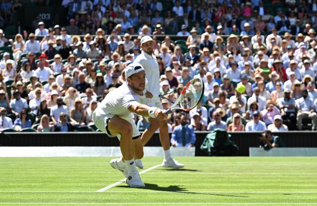 (250712) -- LONDON, July 12, 2025 (Xinhua) -- Julian Cash (front)/Lloyd Glasspool compete during the men's doubles final between Rinky Hijikata (Australia)/David Pel (the Netherlands) and Julian Cash/Lloyd Glasspool of Britain at the Wimbledon Tennis Championships in London, Britain, July 12, 2025. (Xinhua/Zhao Dingzhe)