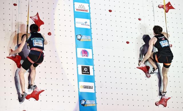 (250713) -- CHARMONIX, July 13, 2025 (Xinhua) -- Samuel Watson (R) of the United States and Rishat Khaibullin of Kazakstan compete during the men's Speed final of sport climbing at the 2025 IFSC Climbing World Cup Speed-Lead in Charmonix, France, July 12, 2025. (Xinhua/Gao Jing)