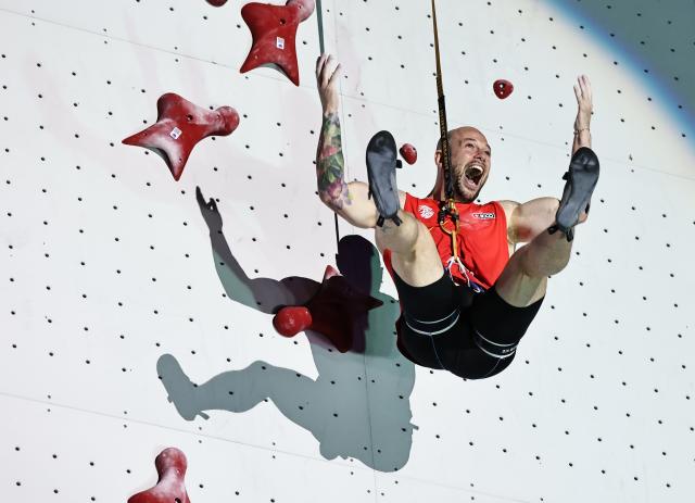 (250713) -- CHARMONIX, July 13, 2025 (Xinhua) -- Erik Noya Cardona of Spain celebrates after the men's Speed quarterfinal of sport climbing at the 2025 IFSC Climbing World Cup Speed-Lead in Charmonix, France, July 12, 2025. (Xinhua/Gao Jing)