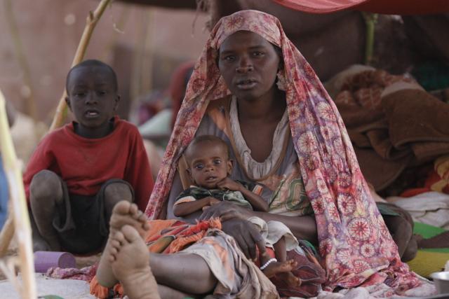 (250713) -- BEIJING, July 13, 2025 (Xinhua) -- A woman holds a child at a displacement camp in El Fasher, North Darfur region, Sudan, on July 9, 2025. The United Nations Children's Fund (UNICEF) said Friday that the number of children suffering from severe acute malnutrition (SAM) in Sudan's North Darfur region has doubled as a result of the country's ongoing military conflict. (UNICEF/Handout via Xinhua)