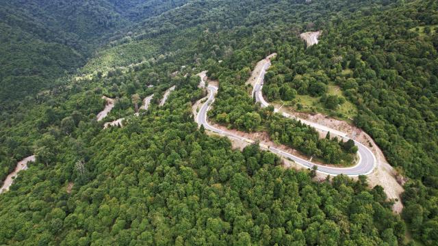 (250713) -- ZHOUQU(GANSU), July 13, 2025 (Xinhua) -- This aerial drone photo taken on July 12, 2025 shows a driveway in Zhouqu County, Gannan Tibetan Autonomous Prefecture, northwest China's Gansu Province. (Xinhua/Chen Bin)